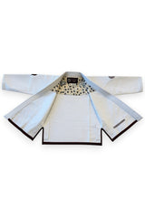 ENIGMA Kimonos white BJJ gi jacket with maroon trim, floral interior lining, and reinforced cotton weave construction.