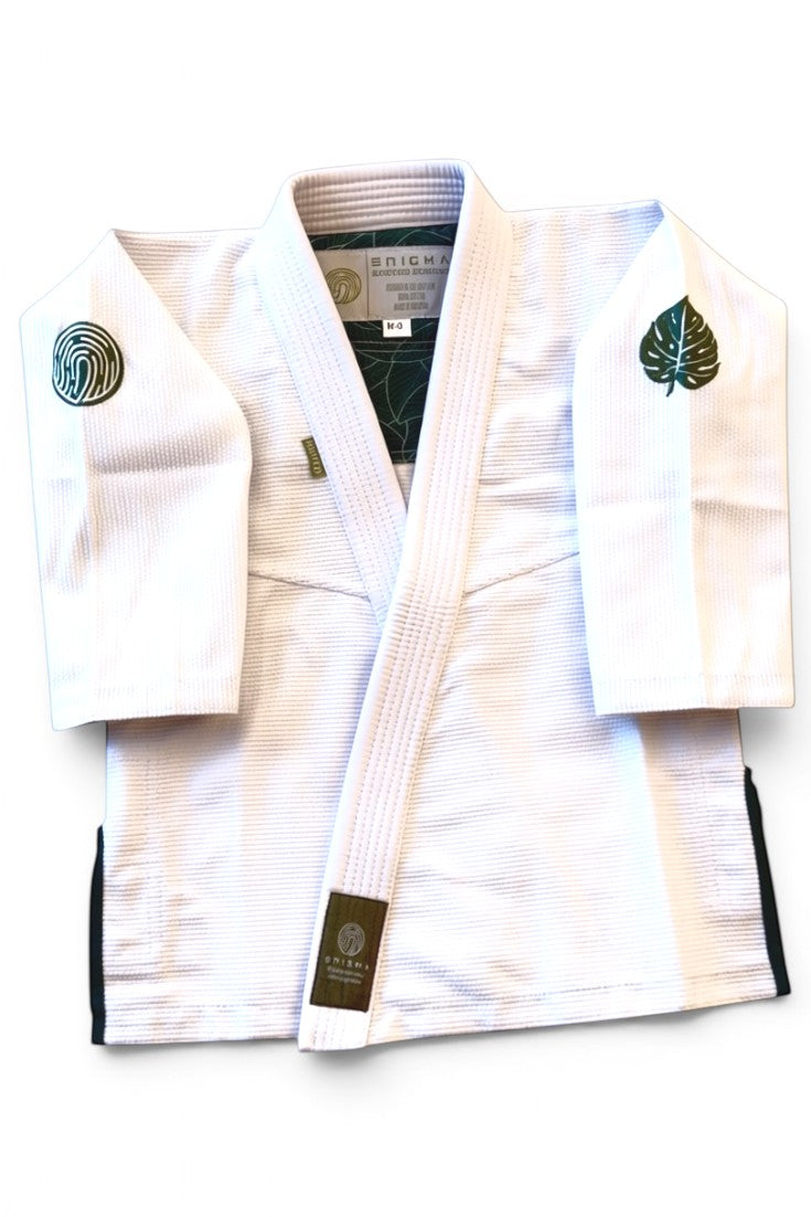 ENIGMA Kimonos white BJJ gi jacket with green botanical embroidery and interior leaf pattern lining.