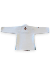 ENIGMA Kimonos white BJJ gi for kids with tropical embroidery and light blue side panels, back view.